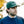 Man wearing a green cap with 'RKL' logo outdoors